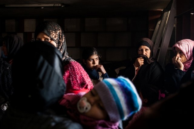Women wait in MSF's mobile clinic to register their names to see a doctor in Northern Syria. Photo: Nicole Tung