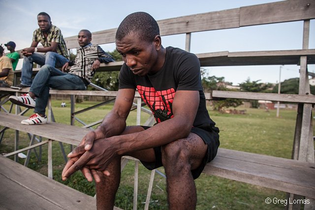 Fabian (28) sits on the stands of the Isipingo sports field