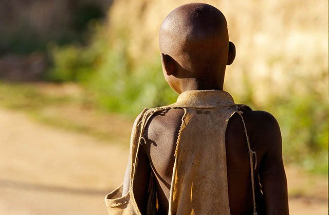 Portrait of child's back in Camp Rukondo. On 6 April 1994, the Rwandan and Burundian presidents were killed in the plane that that was heading to Kigali . The next day the massacres began. Photo: Severine Blanchet