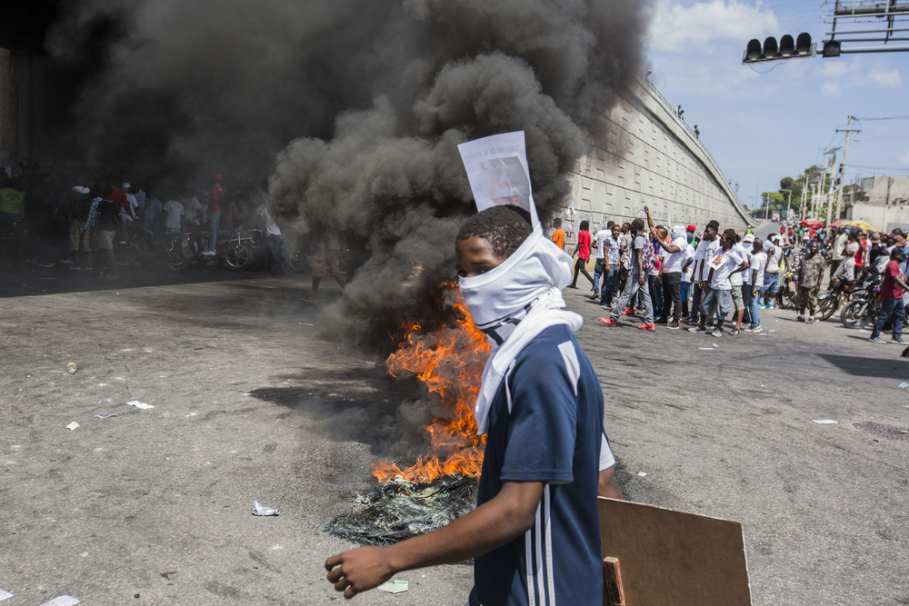 A young boy takes part in a demonstration in Port-au-Prince, Haiti 2019