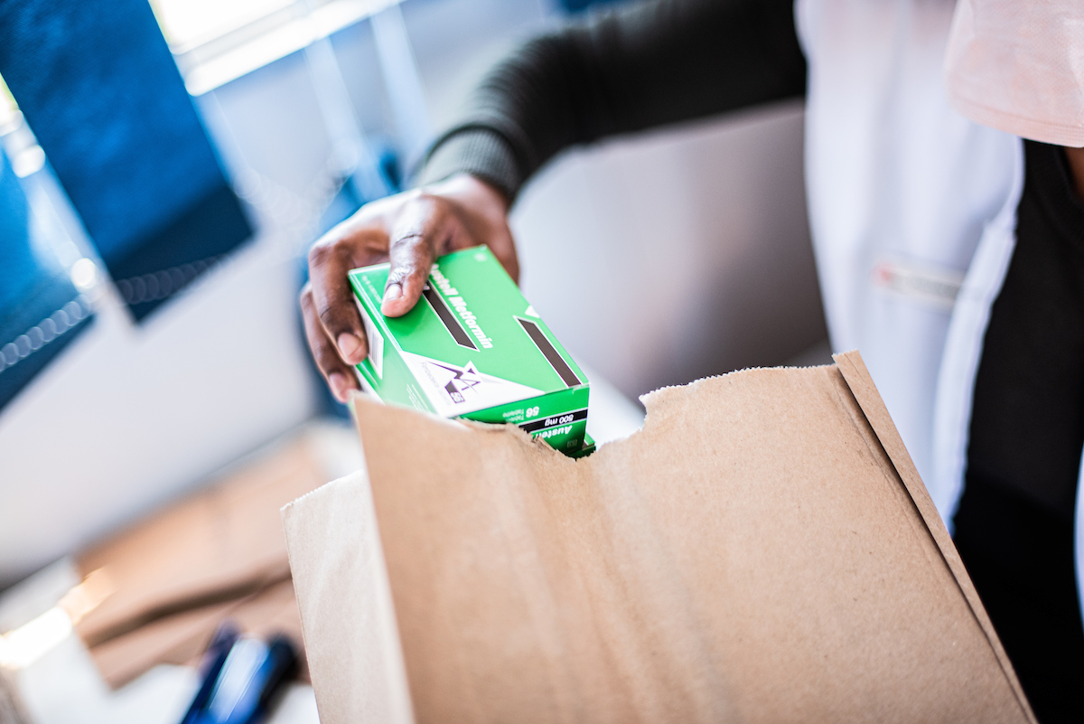 MSF Pharmacy Assistant packing medication