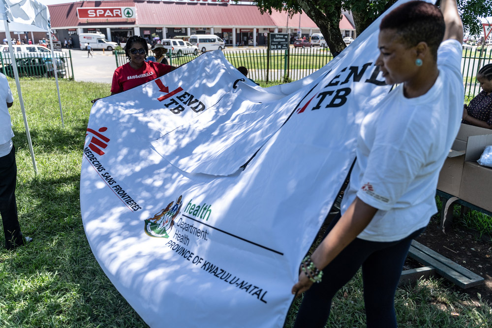 Our teams holding up TB awareness posters in Eshowe