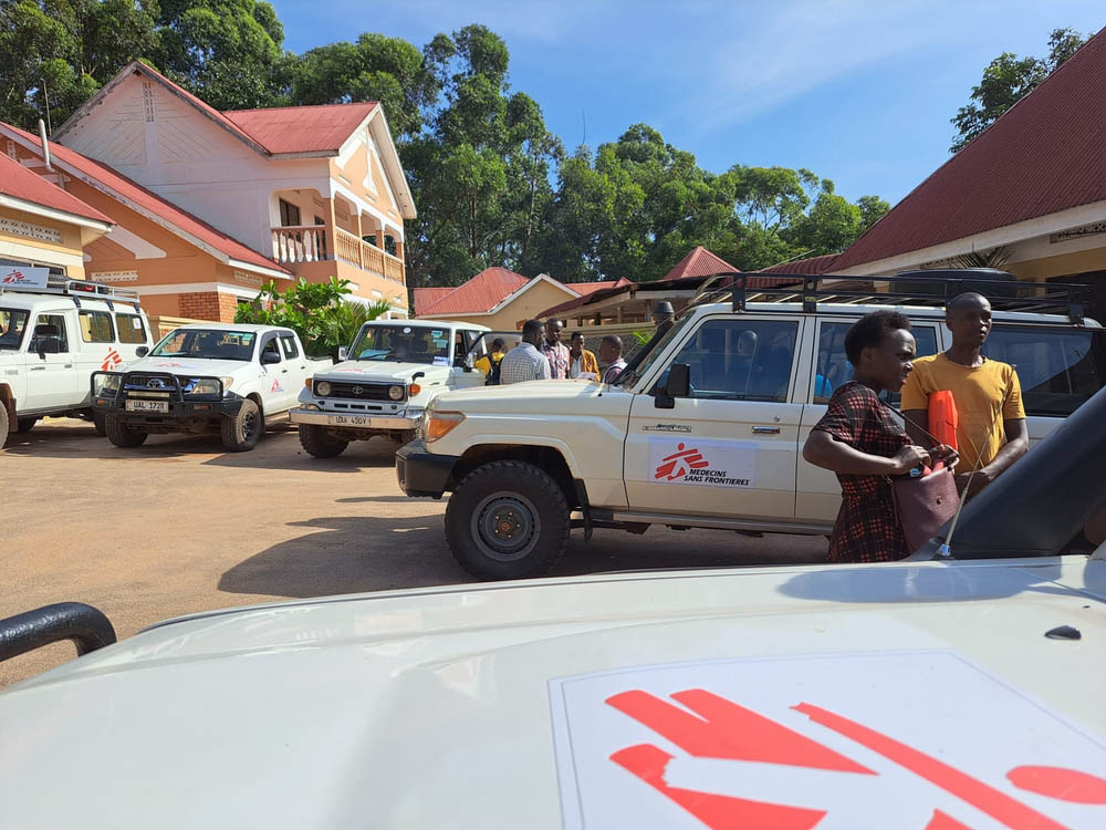 MSF health promoters discussing Ebola infection prevention and control measures with villagers in Kansambya