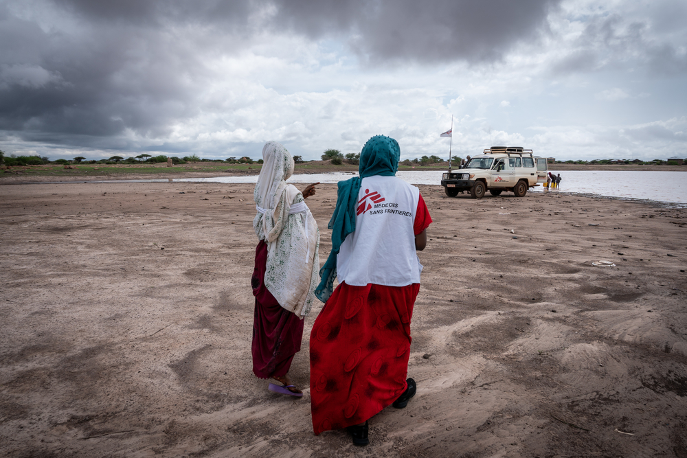 Village of Caado to collect muddy water for a health education session on water purification. Somali region, Ethiopia, March 2019.