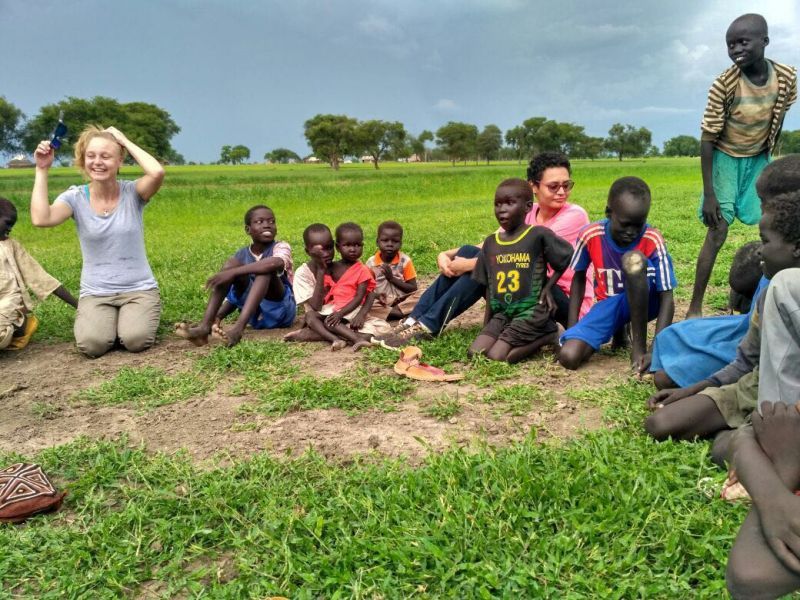 Carissa having a light-hearted session with young South Sudanese kids