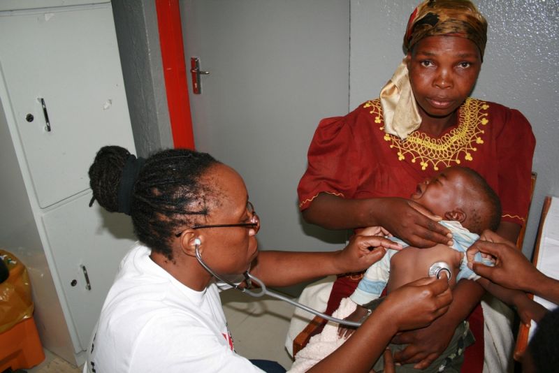 MSF nurse Patricia in Lesotho examining baby Relebohile who was co-infected with HIV and TB