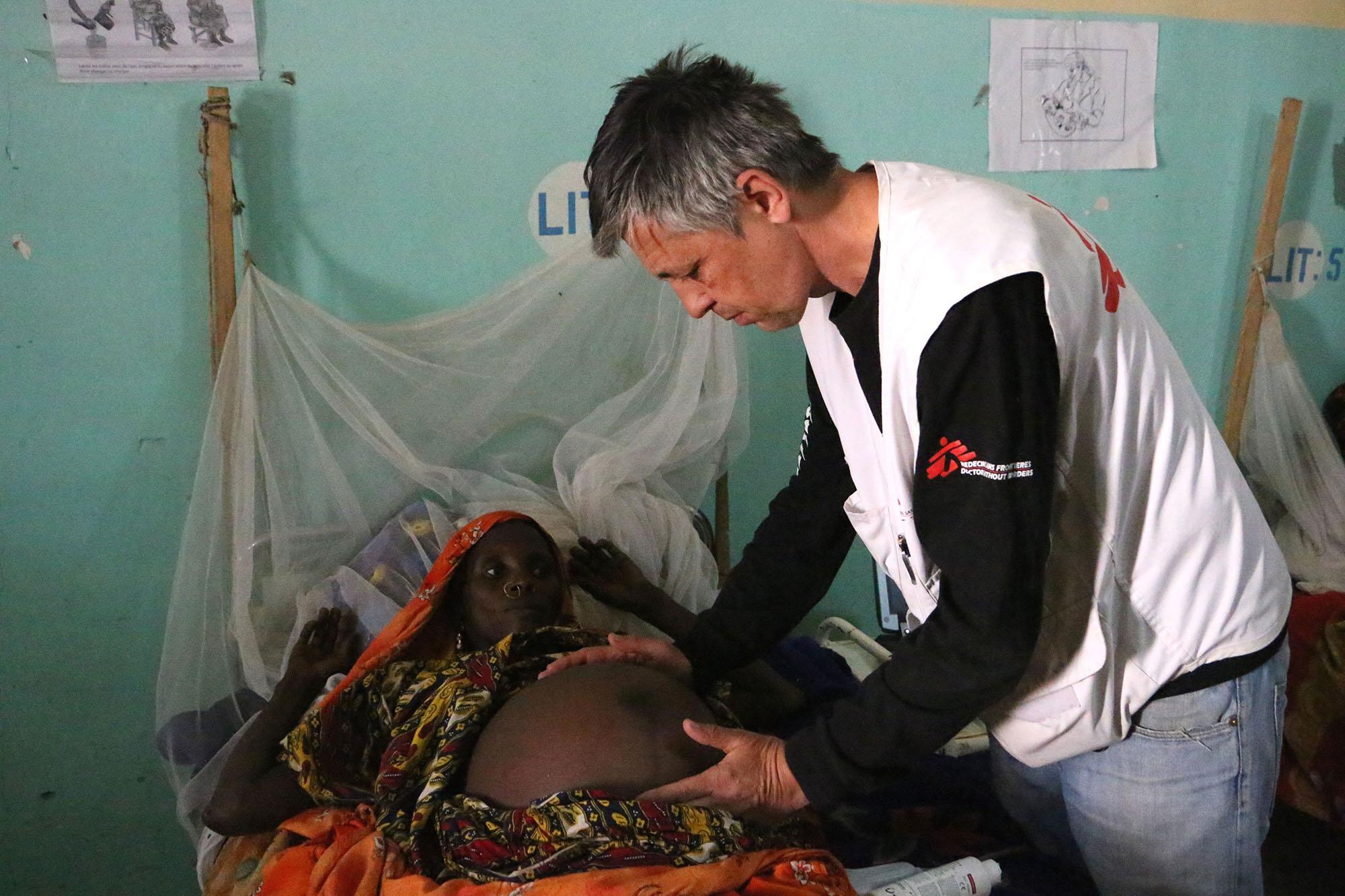 A MSF surgeon from the Chad obstetric surgery gynaecologist obstetrician Bol regional hospital examines a patient as part of our women's health programme