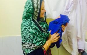 Midwife Amy Le Compte with a new born in Médecins Sans Frontières (MSF) Women's Hospital in Peshawar. Coming from Gisborne in New Zealand she just returned from a six- month assignment in Médecins Sans Frontières (MSF) Women's Hospital in Peshawar, in the north of Pakistan. 