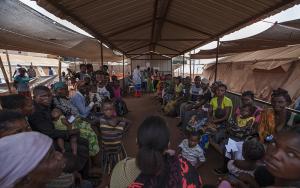 Refugees wait to be vaccinated at the MSF clinic in the Cacanda camp