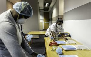 A picture of health workers preparing health promotion items in South Africa