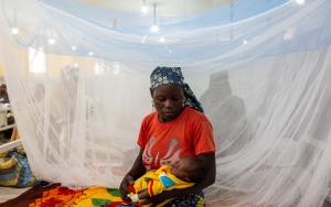 A mother cradles her sick baby in the children’s ward at Mora General hospital. Far-North, Cameroon, March 2020.