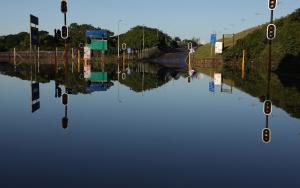 Traffic lights poke out of the water covering a flooded intersection in eThekwini in South Africa. The flood was a climate emergency.