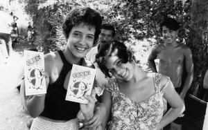 Two young women show the aids information booklet they have just received from MSF. 