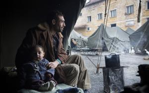 A Syrian man and his infant son sit in their tent at Harmanli Camp, a former military installation in Bulgaria. A major increase in the number of migrants crossing into Bulgaria in recent months has strained Bulgaria's existing system. Authorities have quickly moved migrants into makeshift facilities including abandoned schools, tents, containers and military barracks. 