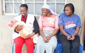 Marvellous Nzenza with her mother Jacqueline and Doctors Without Borders (MSF) social worker Relative Chitungo