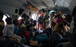 Patients and their families inside the UN helicopter that is used by MSF to refer patients between Rhoe and Bunia hospital. Since the attacks on Drodro in November forced people to flee and teams to abandon the General Referral Hospital there, the helicopter is the only means of referral and supply to the Rhoe IDP (Internally displaced people) camp, where MSF runs the health centre. 