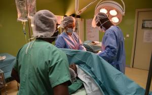 Surgery team performing a caesarean section to deliver a patients' baby. Côte d'Ivoire, March 2017.