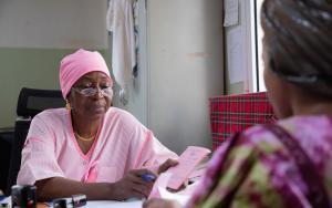 Nene Sow, MSF midwife, talks with her patient after screening her for breast and cervix cancer at Gabriel Toure hospital in Bamako, Mali 