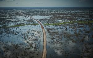 An aerial view of a road and dykes being built