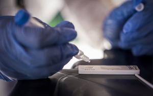 A medical staff member conducting a test