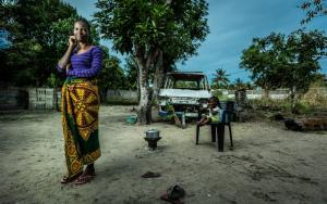 Portrait of sex worker Aida at her home with one of her children