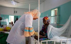 MSF treating patient with Malaria