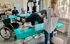 Image showing an MSF physiotherapist with war-wounded patient, Ukraine-Russia war. 