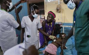 Atong Dut Deng, 8 years old, infected with celebral malaria. She is being attended to by MSF medical staff in the ICU at MSF supported Aweil State Hospital.