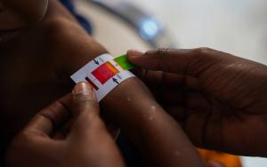 A band around a child’s arm, indicating a red, orange or green malnutrition status.. MSF, Doctors Without Borders, Malnutrition