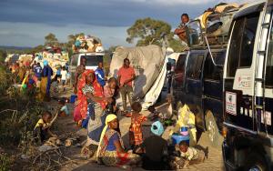 People displaced by the conflict in Cabo Delgado, a northern province in Mozambique, wait next to a truck on the outskirts of Mueda. They had previously been resettled in other areas of the province but are now aiming to reach Palma, a coastal town that was attacked earlier this year and where some people have already gradually returned. 