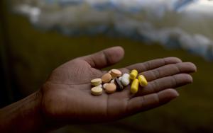 Patient Nanyanyiso Baloi holds her treatment regimen for pre-XDR-TB, which includes delamanid and bedaquiline. Khayelitsha, Western Cape.