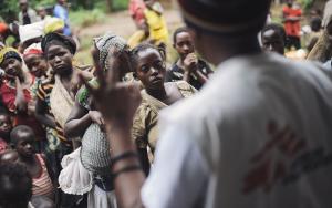 Mothers listen to Alpha Atafazali Bahunga telling them that they require three rounds of vaccination during a session in a church-cum-school in the village of Kalungu II in Masisi territory in the east of the Democratic Republic of the Congo on August 14, 2014.