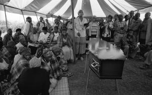 Family and friends at the funeral of an AIDS patient.