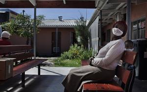 A woman and her son outside a waiting room in Mayenzeke tuberculosis clinic in Khayelitsha