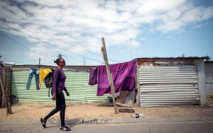 XDR-TB patient walks home from her local clinic. Khayelitsha, Western Cape, South Africa.