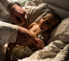 A baby being examined in the neonatal care unit at Boost Hospital, Afghanistan