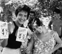Two young women show the aids information booklet they have just received from MSF. 