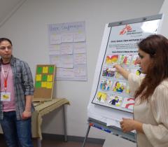 Psychosocial group session “How to deal with stress” in the first reception center in Schweinfurt with Salah Al-Hamada and Parisa Zare Moayedi; participants from Afghanistan 