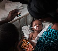 a babt being treated in the paediatric emergency ward at Simão Mendes National Hospital in Guinea-Bissau.