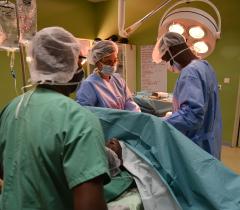 Surgery team performing a caesarean section to deliver a patients' baby. Côte d'Ivoire, March 2017.