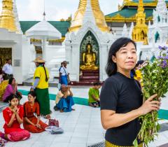 MSF nursing team supervisor praying at the Shwe Dagon Pagoda