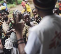 Mothers listen to Alpha Atafazali Bahunga telling them that they require three rounds of vaccination during a session in a church-cum-school in the village of Kalungu II in Masisi territory in the east of the Democratic Republic of the Congo on August 14, 2014.