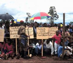 KIGALI, RWANDA, AFRICA, 30.04.95. Tutsi survivors of the genocide at the one year anniversary of the genocide. Beneath umbrellas. 