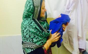 Midwife Amy Le Compte with a new born in Médecins Sans Frontières (MSF) Women's Hospital in Peshawar. Coming from Gisborne in New Zealand she just returned from a six- month assignment in Médecins Sans Frontières (MSF) Women's Hospital in Peshawar, in the north of Pakistan. 