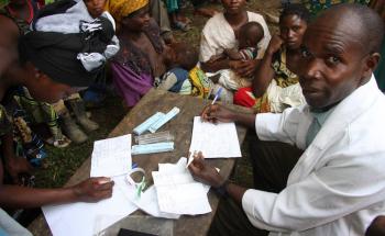 Mobile clinic by motorbike around Pinga in North Kivu province Democratic Republic of Congo 2012