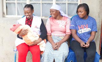 Marvellous Nzenza with her mother Jacqueline and Doctors Without Borders (MSF) social worker Relative Chitungo