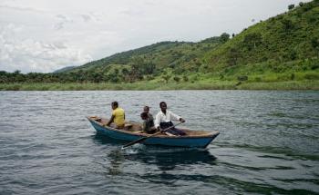 MSF staff on a boat in Kabanga village, South Kivu DRC