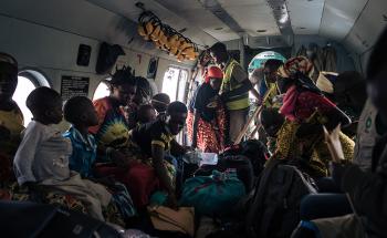 Patients and their families inside the UN helicopter that is used by MSF to refer patients between Rhoe and Bunia hospital. Since the attacks on Drodro in November forced people to flee and teams to abandon the General Referral Hospital there, the helicopter is the only means of referral and supply to the Rhoe IDP (Internally displaced people) camp, where MSF runs the health centre. 