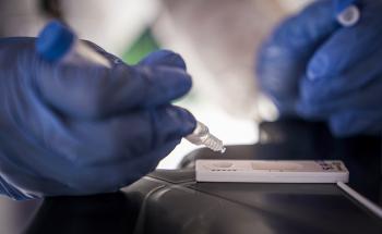 A medical staff member conducting a test