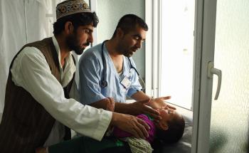 A child being examined by a doctors at Doctors Without Borders Kunduz Trauma Centre